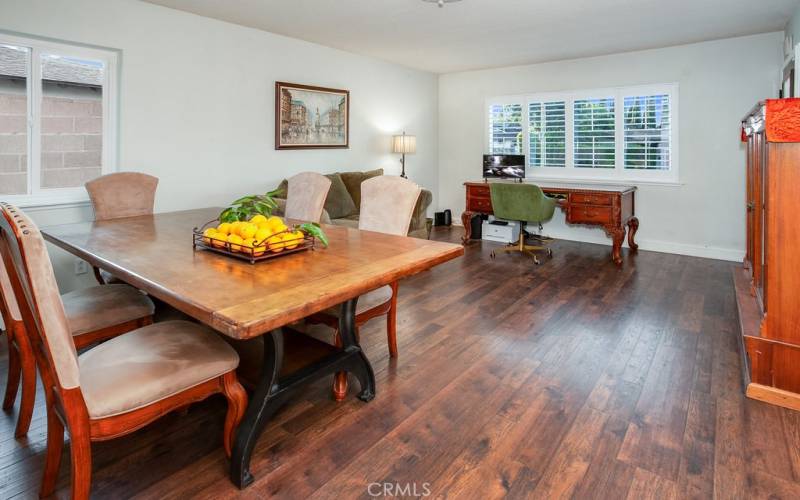 The dining room with its gleaming newer high-end wood laminate floors is perfect for any occasion.