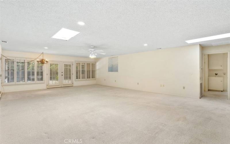 Living Room/ Sky Light/Exit to Patio/