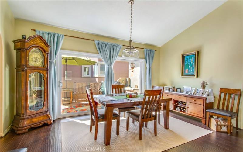 Dining room area and dual pane sliders leading into large back patio.