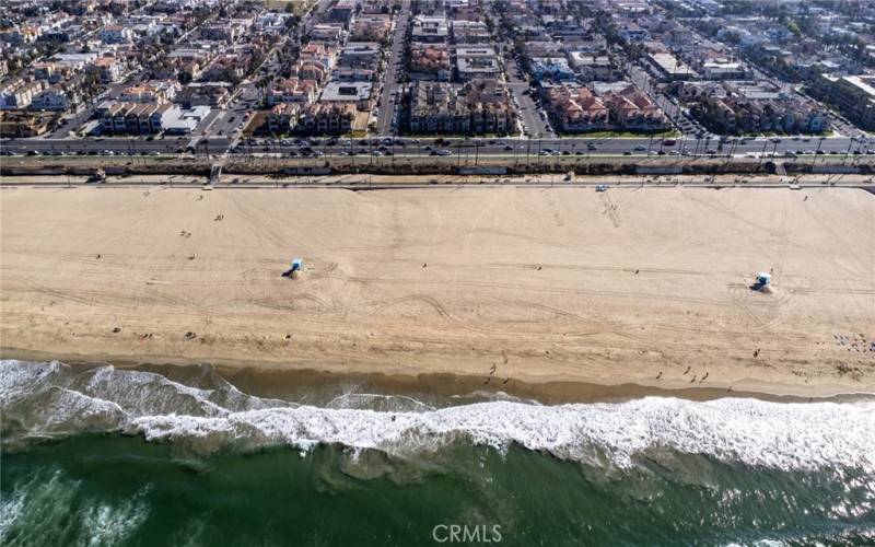 Arial of view from ocean towards community.