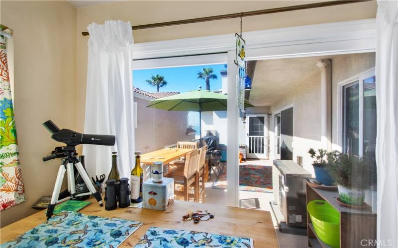 kITCHEN NOOK WITH PEEK-A-BOO VIEW OF THE OCEAN FROM THE KITCHEN TABLE!