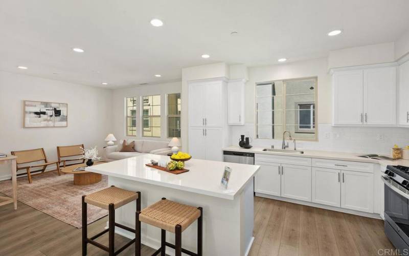 Kitchen with view into Family Room