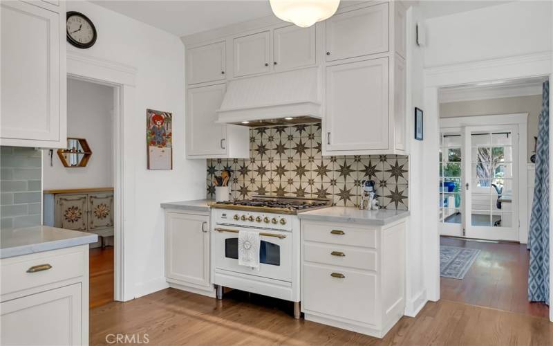 Remodeled kitchen with Hallman stove, built in Italy by Bertazzonni. Chef-grade power with burners, convection electric oven, and gorgeous backsplash!