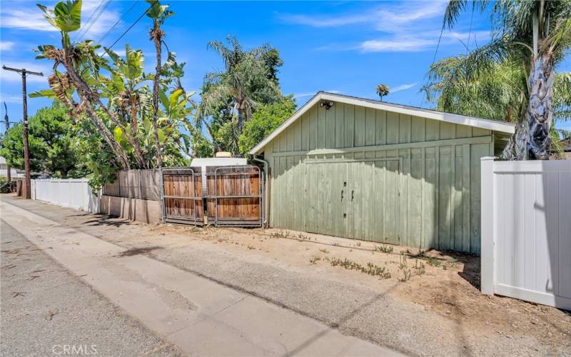 Alley view of the garage and RV entrance gate.