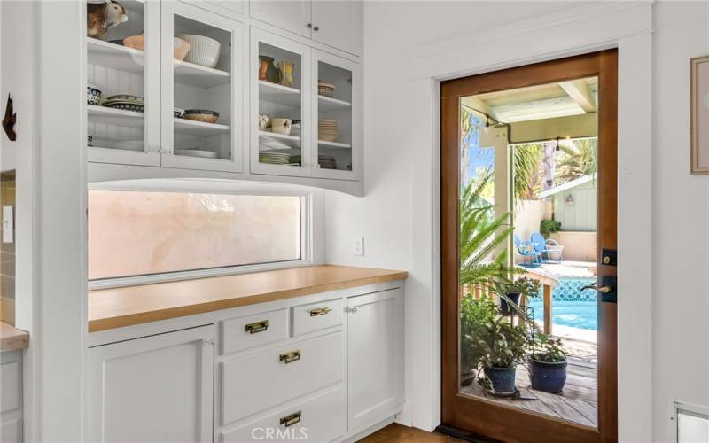 This whole buffet area in the kitchen was custom made to match the original built-in buffet in dining room, and sellers even found original hardware that matched the dining room hardware!