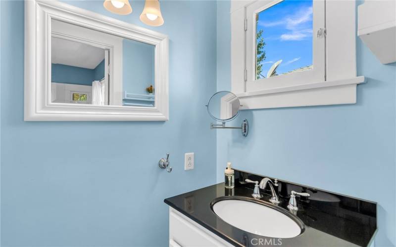 Remodeled primary en suite half bath.