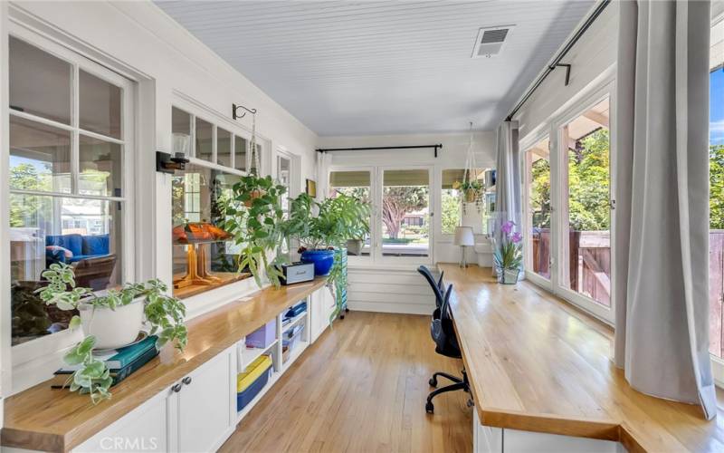 Sunroom/office is overflowing with natural crisp light.