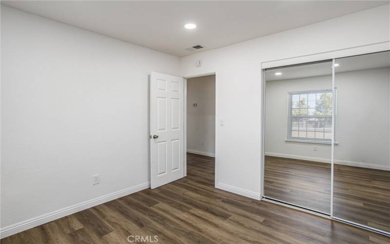 Bedroom #2 with mirror closet doors