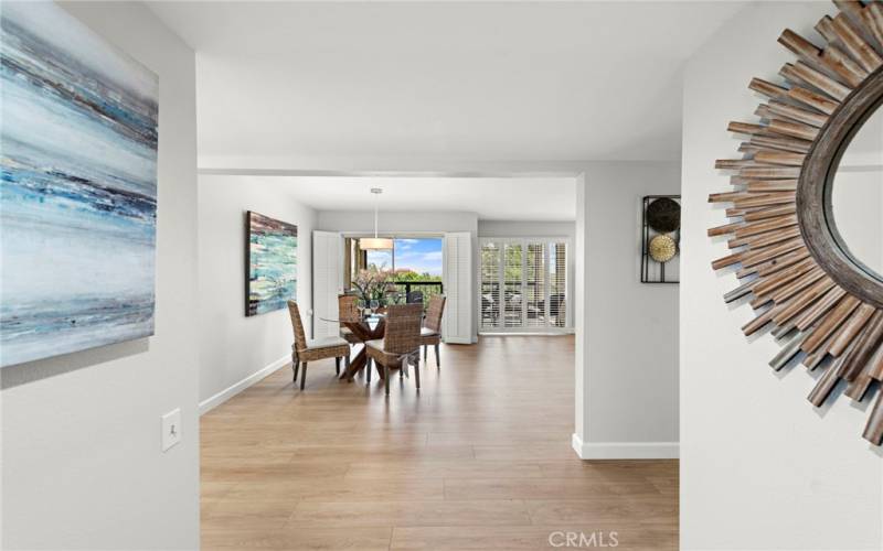 A double-door entry foyer expands into the open floor plan.