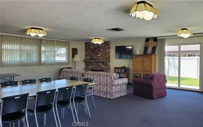 Community Recreation room with Kitchen, Fireplace and piano