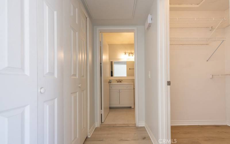 Hall to bathroom (laundry on left, closet on right)