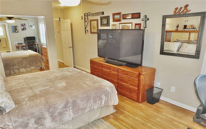 Another view of primary ensuite with mirrored wardrobe doors on walk in closet.