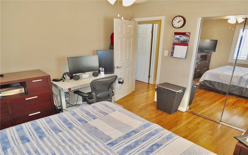 View looking into hallway and first bedroom door.