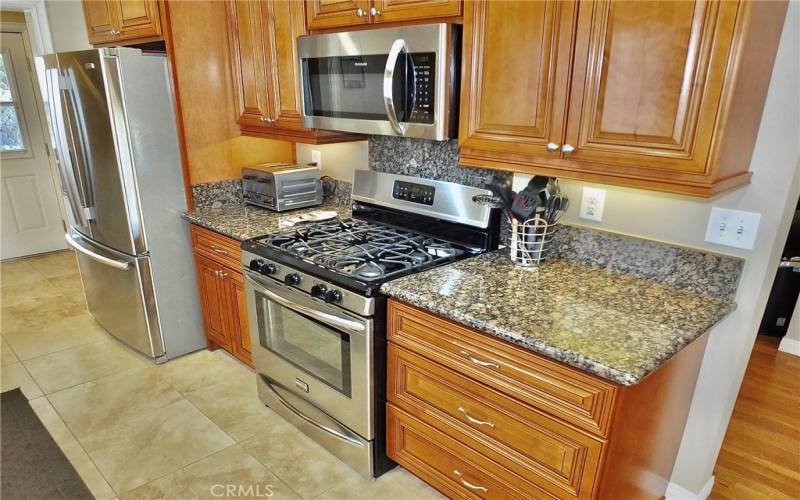 view of under cabinet lighting on the beautiful maple cabinets