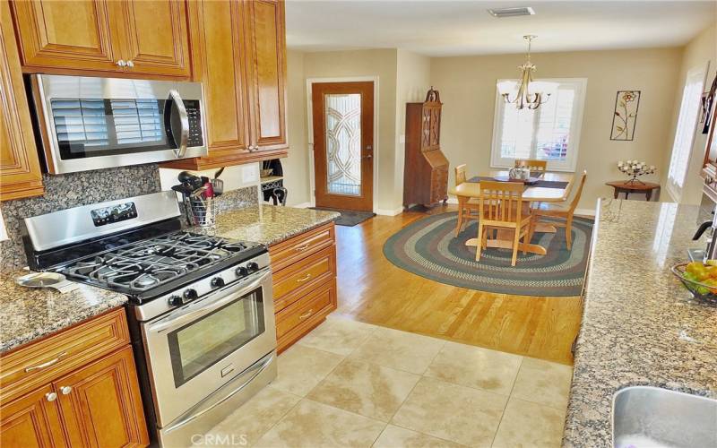 A view that highlights the stainless steel oven/stove and microwave you could enjoy cooking a fabulous meal for your family and friends.