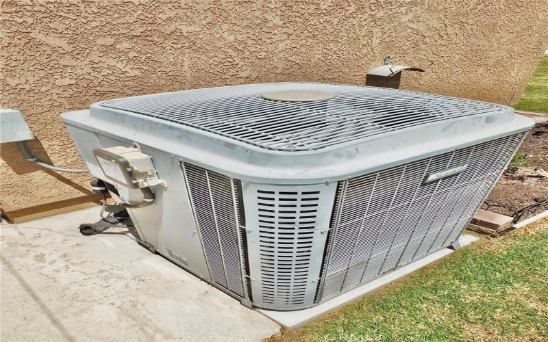 View of the home's air conditioning unit that will keep you cool on those hot days.