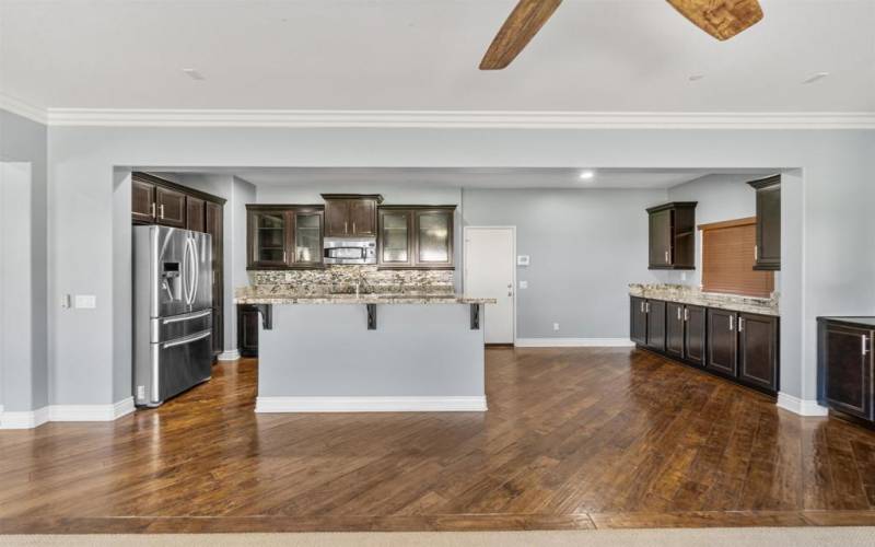 View of Kitchen and Dining Area with more cabinets and countertop space for entertaining