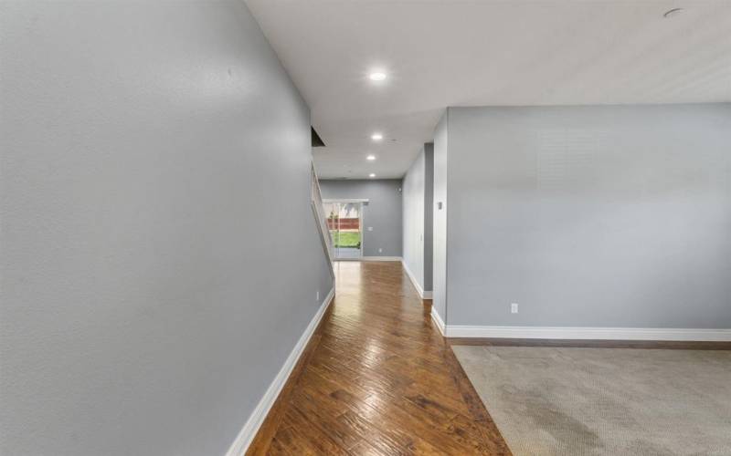 View from front door to past Family Room and down to the Formal Dining Room