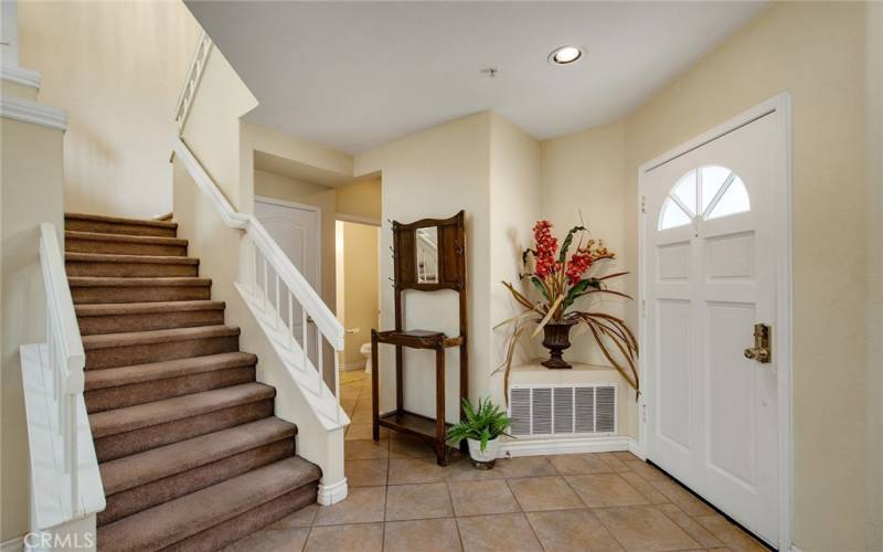 Front entry, carpeted stairs