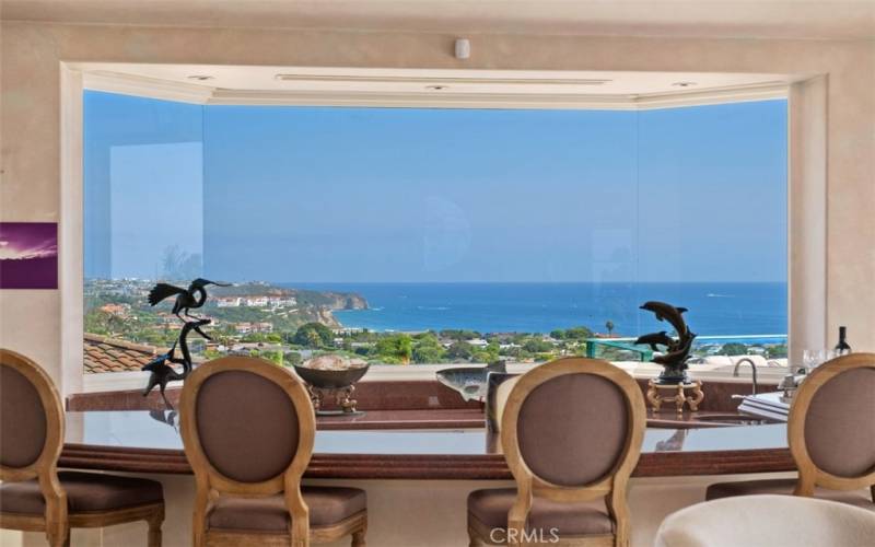 Close up of stunning picture window in great room featuring white water views and Ritz Carlton beaches.