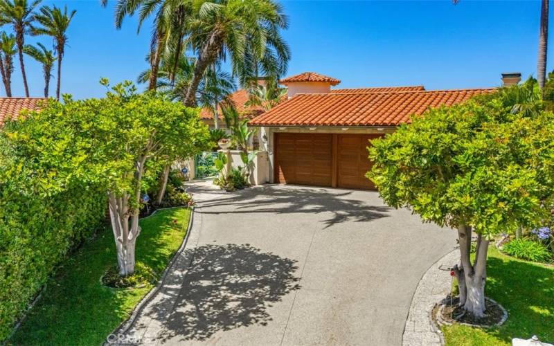 Drive way enterance to 3 car garage.