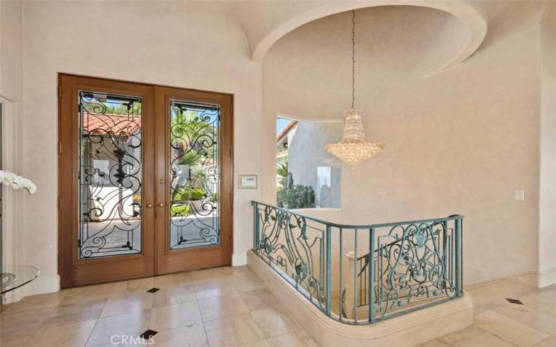 entry foyer with gorgeous chandelier.