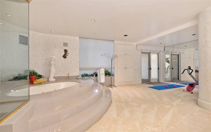 View of soaking tub, and exercise area.