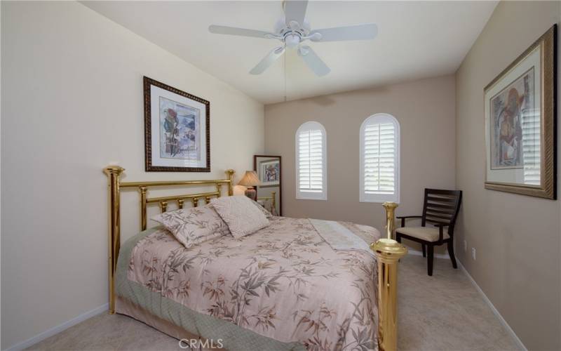 2nd bedroom with ceiling fan currently been used as a flex room with an open archway entry and no closet.