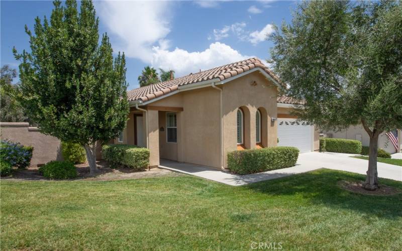 HOA maintained lush front yard included front water. Covered front porch.