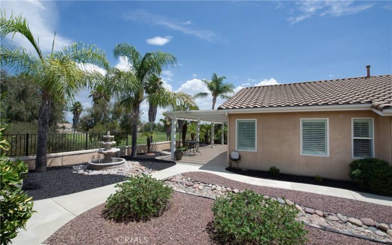 Extraordinary wide side yard overlooking the golf course.