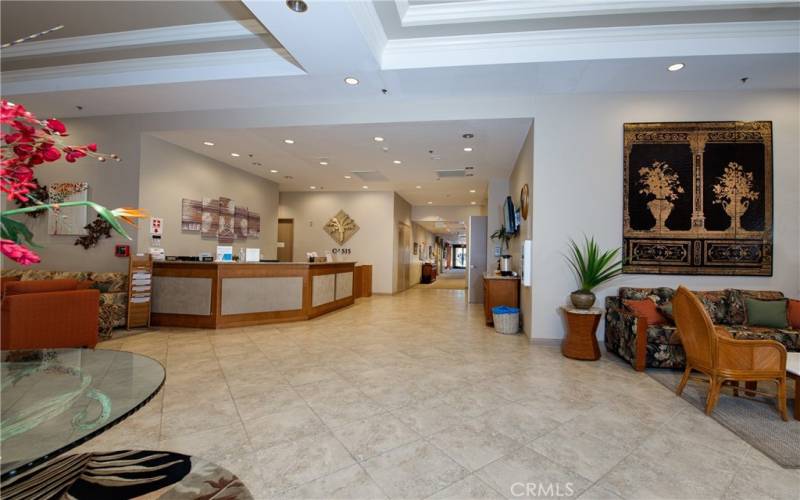 Lobby looking towards the media/card room, fitness center, multi-purpose rooms, library, computer center and billiard parlor.