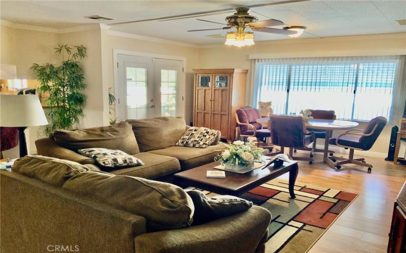 Comfy family room with french doors to covered patio in front