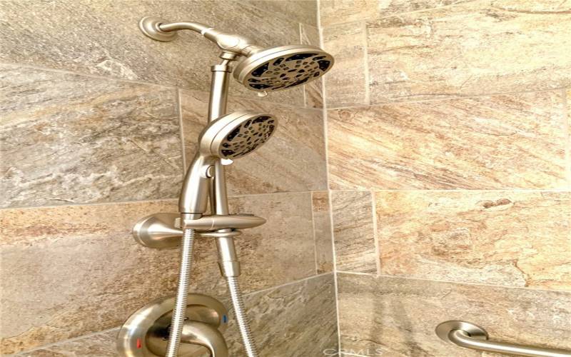 tiled primary shower with dual shower heads