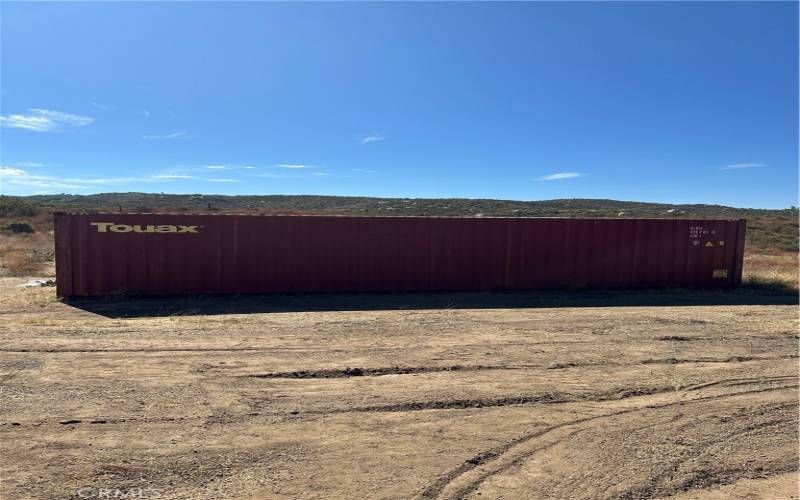 Double cargo container that will remain with the property.