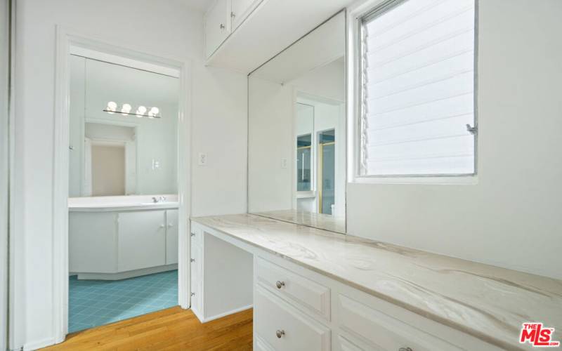 Dressing area looking into bathroom