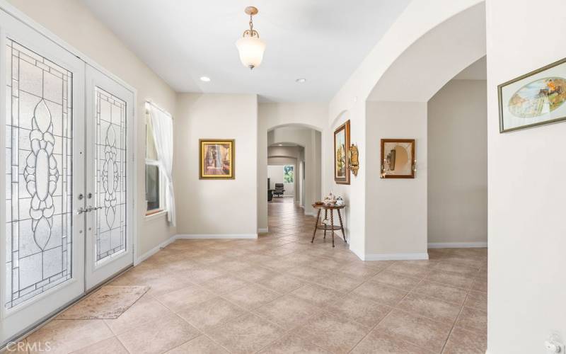 Entry with stained glass double entry doors.