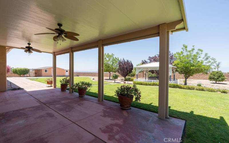 Large, covered patio with ceiling fans