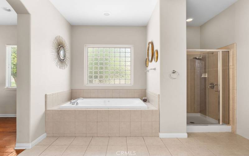 Primary soaking tub, shower.