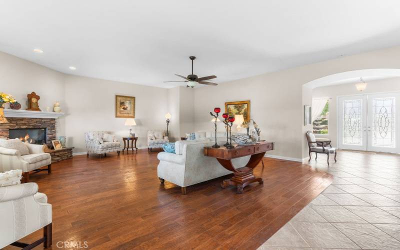 Great Room with Wood floors and ceiling fan.