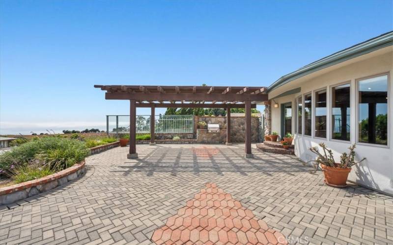 Outdoor patio with pergola, landscaping, pavers, BBQ, and views of the ocean and Catalina.