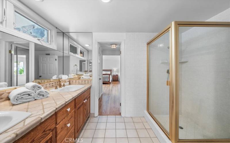 Primary Bathroom #1 with dual sinks and step in shower.