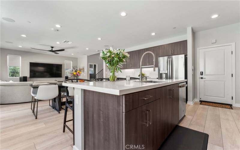 KITCHEN ISLAND WITH PULLOUT TRASH BINS.