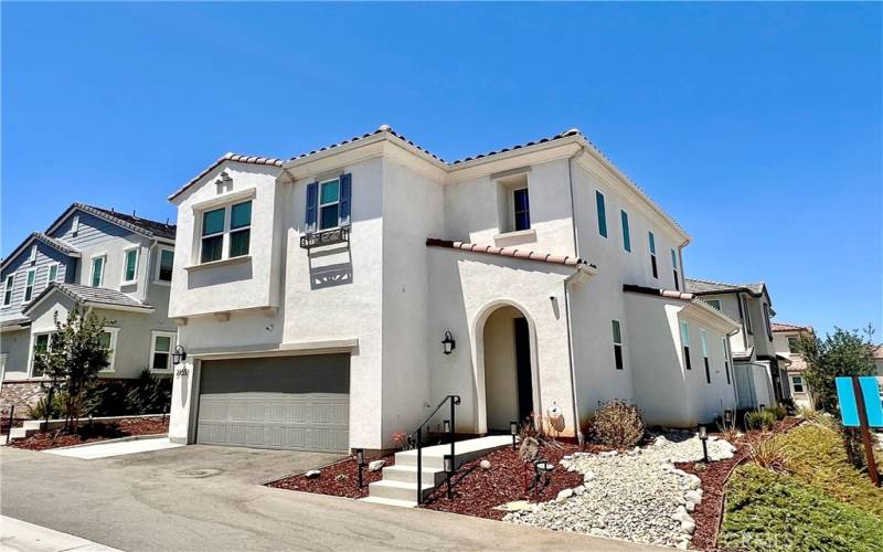 CORNER, PRIME LOT ELEVATION. RING CAMERA AT FRONT  ENTRY. FULL FRONT YARD LANDSCAPE WITH UNDERGROUND DRIP IRRIGATION SYSTEM.