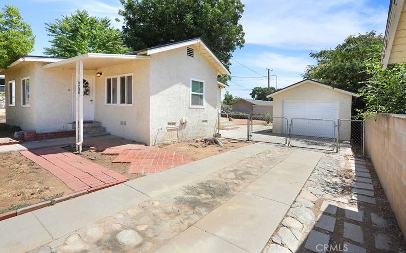 Gated backyard, lots of parking and single car garage.