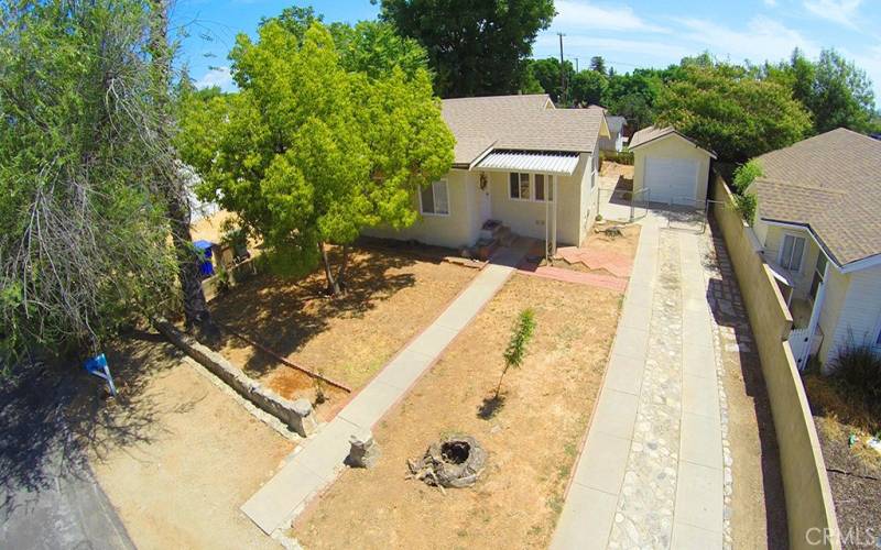 Drone shot of long driveway and lots of parking out front!