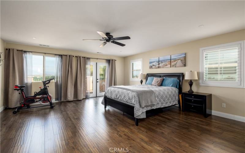 Primary bedroom with balcony access