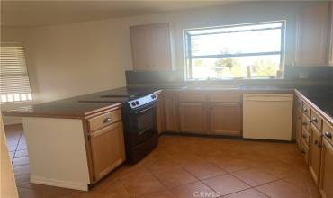 Kitchen with Granite counters and downdraft range