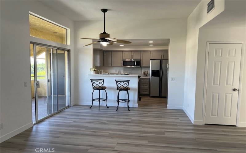 Dinning area with ceiling fan and access to balcony