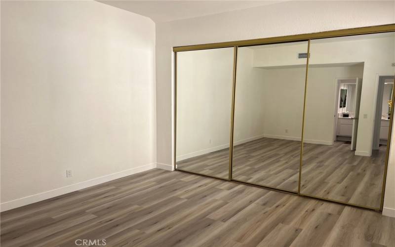 Primary bedroom has oversized mirrored closets