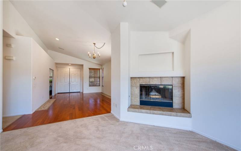 The family room features a stunning raised hearth fireplace, extraordinary panoramic view, a celing fan and surround sound speakers.